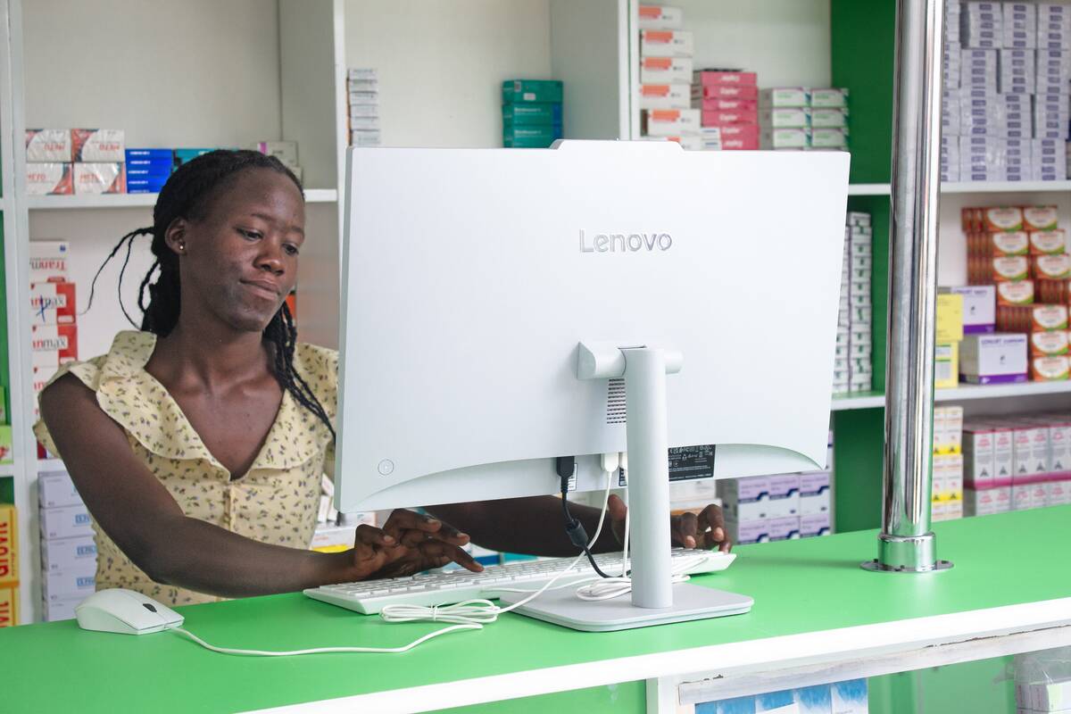 A team member at the Aciga Venture Pharmacy workstation