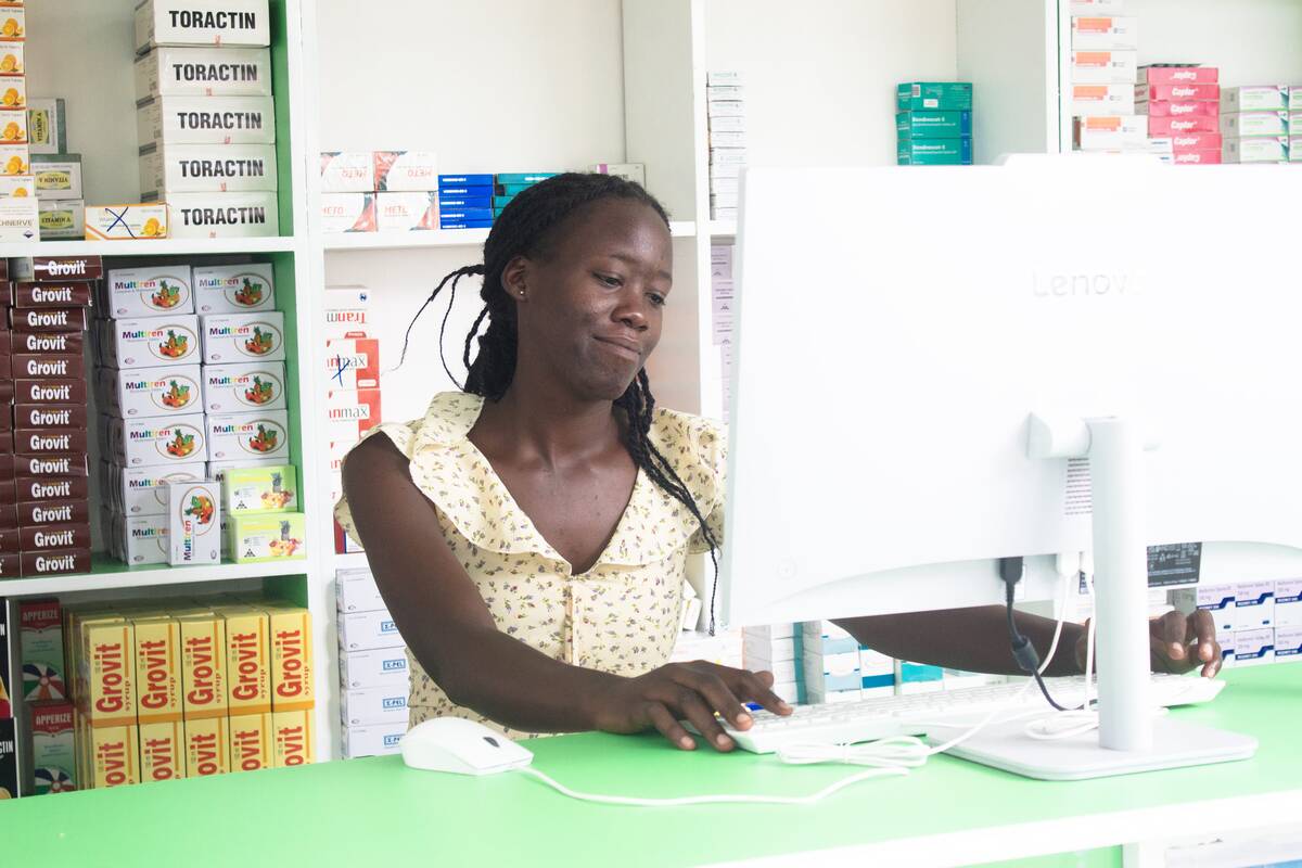 A team member at the dispensing desk